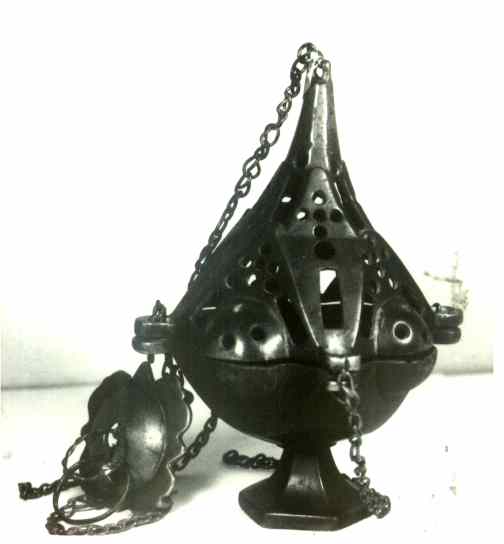 Metal liturgical incense on chains, used in church ceremonies.