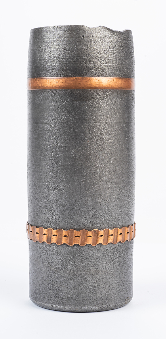 Metal shell jacket with two copper rings.