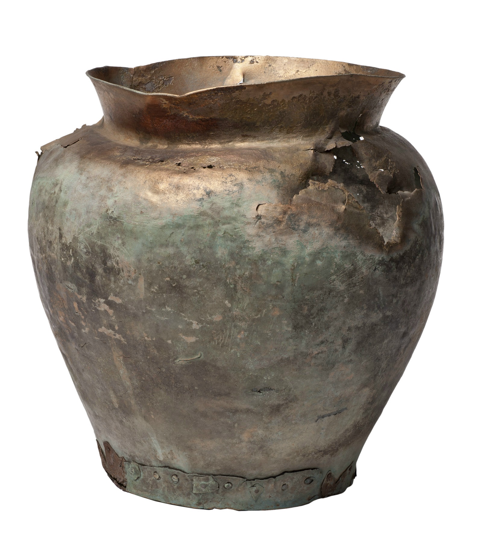 An ancient, heavily corroded bronze vessel with a cracked rim and a greenish patina.